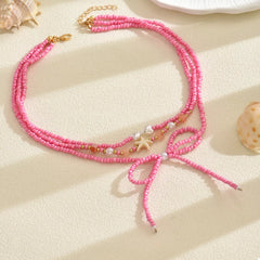 Beaded Three-Layered Necklace with Bow and Starfish Charms